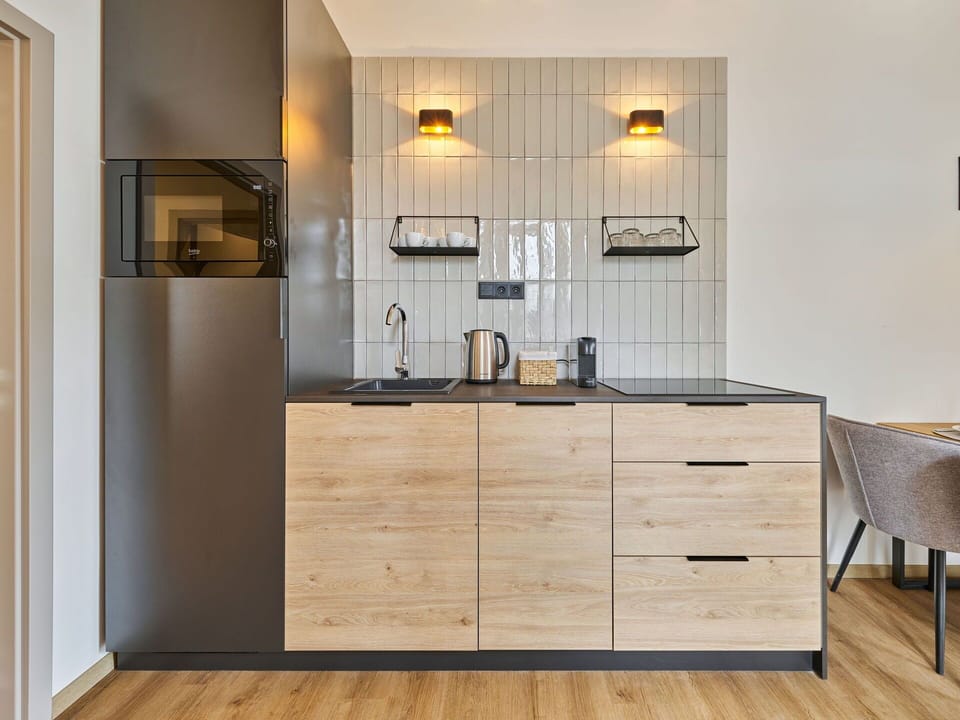 Furniture, Cabinetry, Interior Design, Wood, Flooring, Countertop, Kitchen, Light Fixture, Floor, Lighting