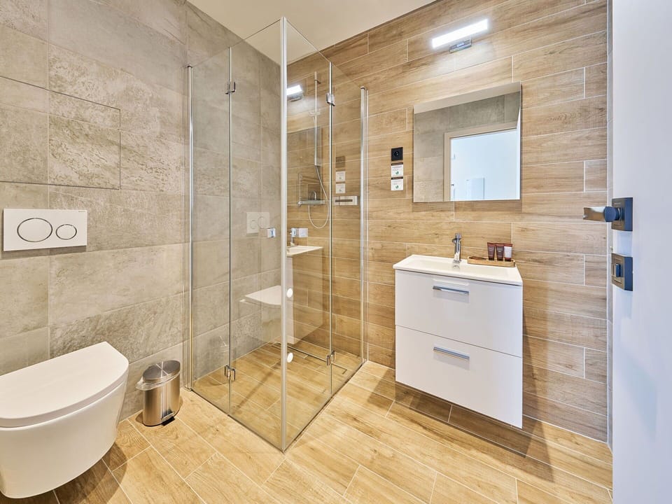 Flooring, Floor, Interior Design, Plumbing Fixture, Bathroom, Bathroom Cabinet, Plumbing, Tile, Toilet, Room