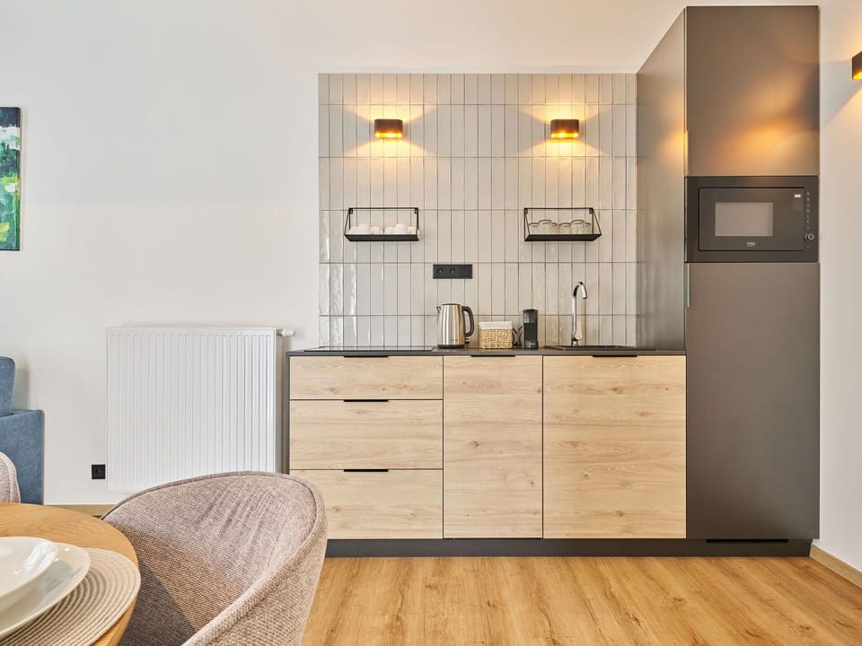 Furniture, Interior Design, Wood, Cabinetry, Flooring, Countertop, Kitchen, Floor, Lighting, Room