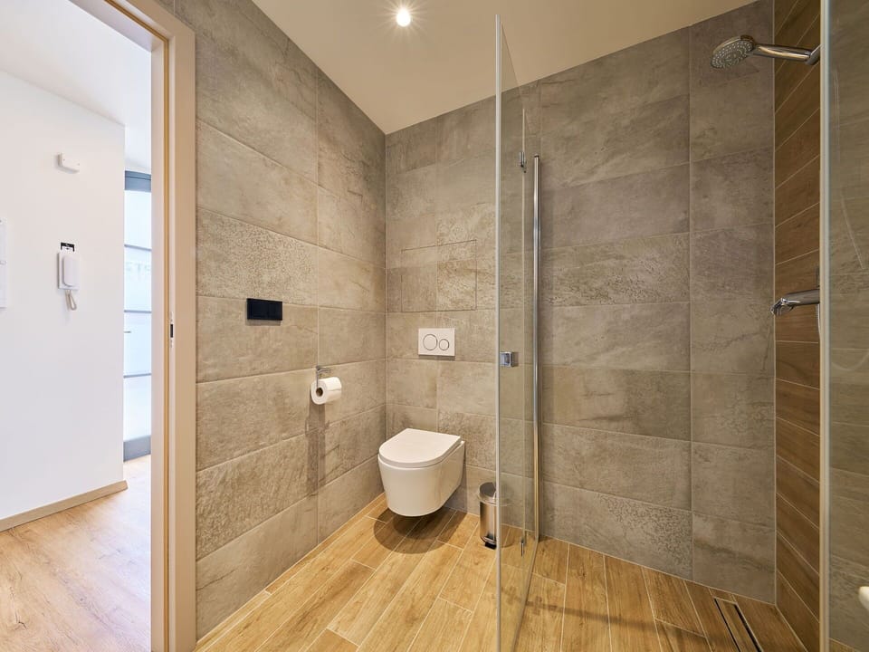 Flooring, Wall, Floor, Interior Design, Plumbing Fixture, Bathroom, Toilet, Tile, Plumbing, Room