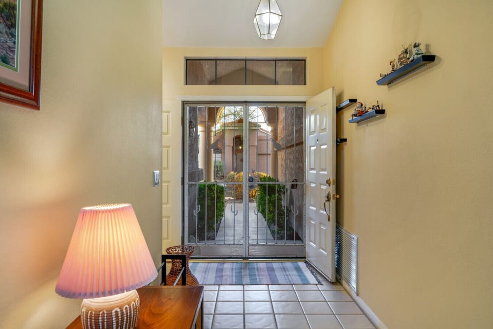 View of the well-manicured veranda from the foyer