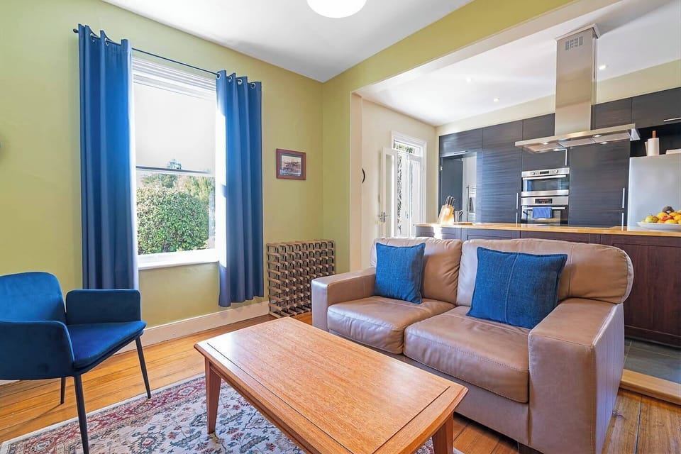 Enjoy easy conversations and shared moments in this open living area, where the kitchen and seating area connect seamlessly.