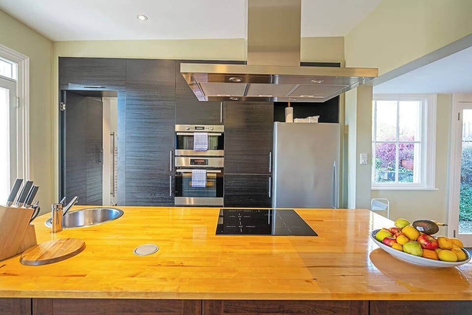 Cook up a storm in the full kitchen featuring premium appliances, wide benches, and thoughtful touches for home-style meals.