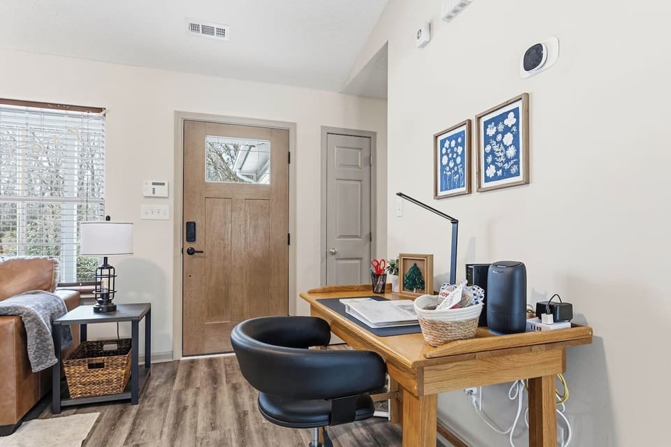 Living Room with 65" Smart TV, dedicated workspace, cards, board games and cozy seating!