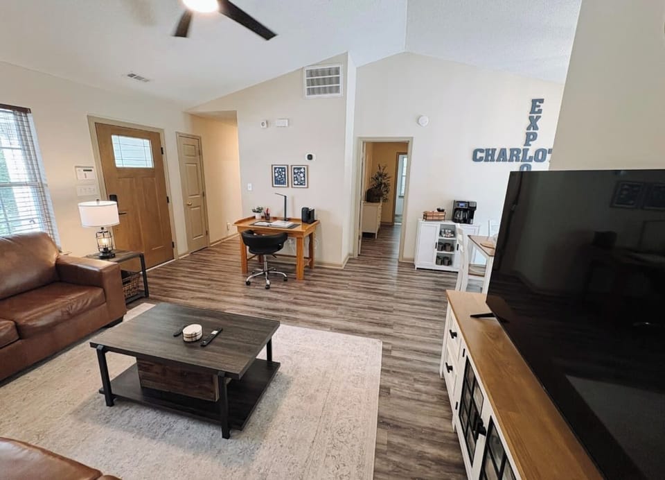Living Room with 65" Smart TV, dedicated workspace, cards, board games and cozy seating!
