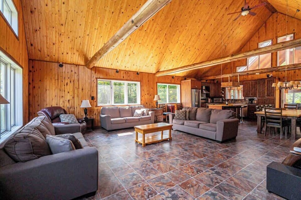 Plush seating and tall ceilings make this space feel open yet inviting