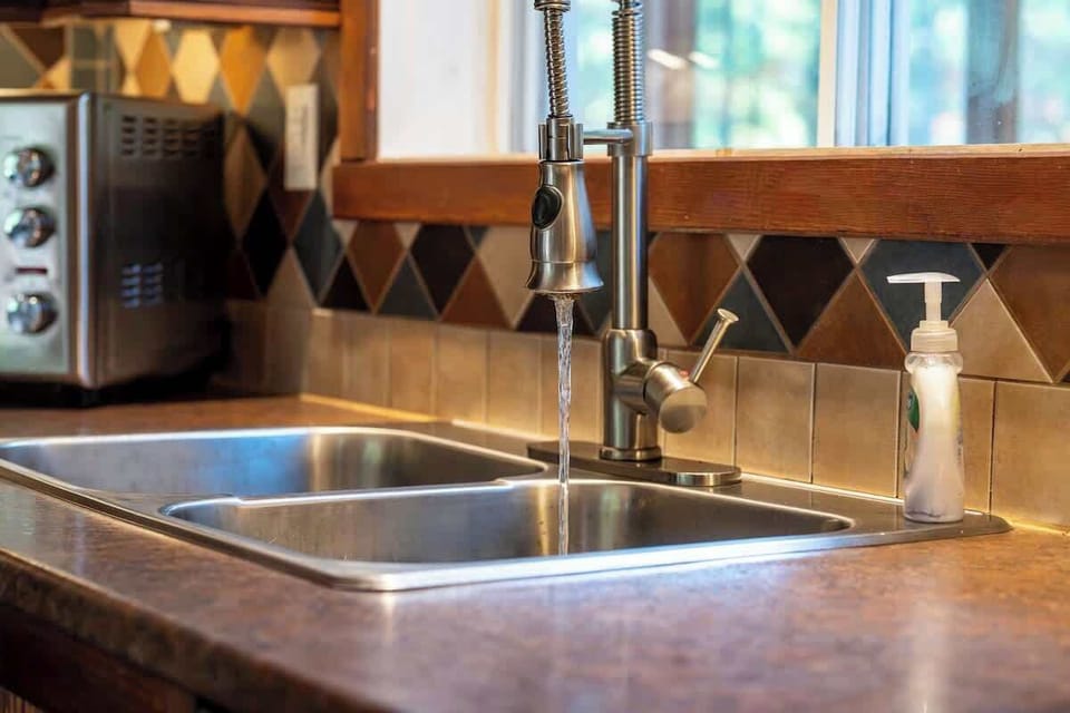 Dual sink and modern fixtures make this bathroom both stylish and functional
