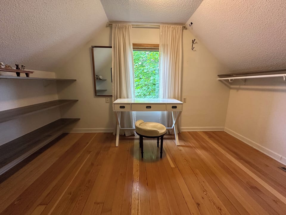 Upstairs overflow room.  Office/sleeping room.
