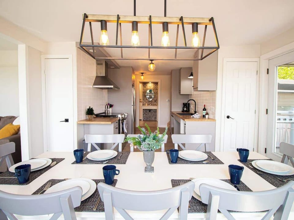 Kitchen area with a stylish dining setup for casual meals or family gatherings.