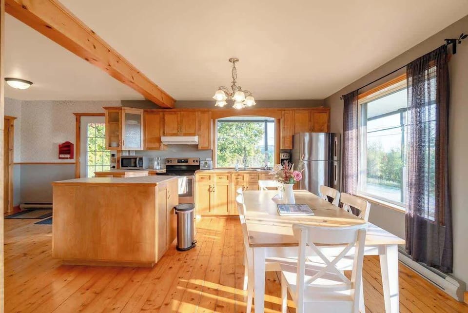 Kitchen with a spacious layout and wooden countertops, offering ample space for cooking.