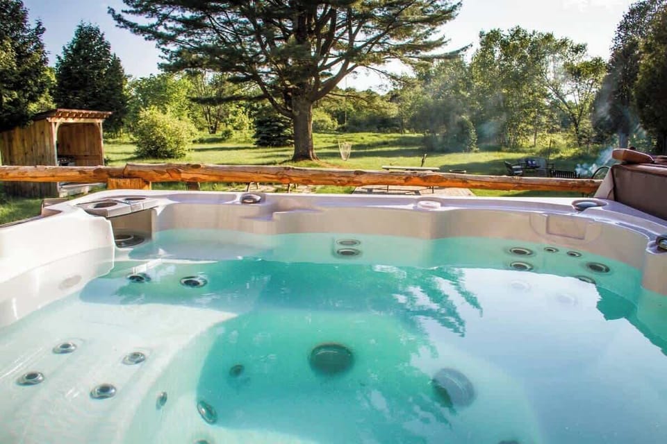 A relaxing soak in the hot tub with a stunning snowy backdrop.