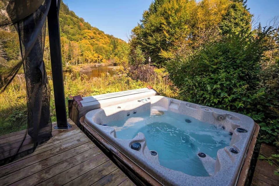 Private hot tub on the patio, offering the perfect spot to unwind while surrounded by nature.