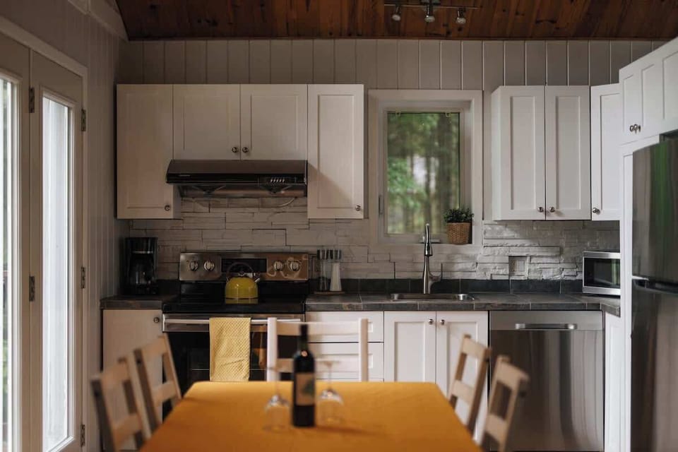 A well-lit dining area for family meals, with a view of the outdoor space.