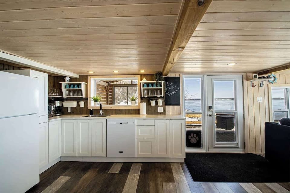 Fully equipped kitchen with modern appliances and a warm, inviting feel