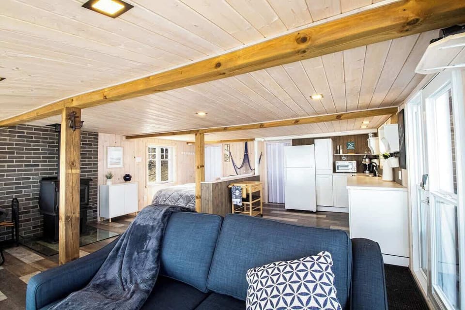 Relax in the open living room, featuring beautiful river views