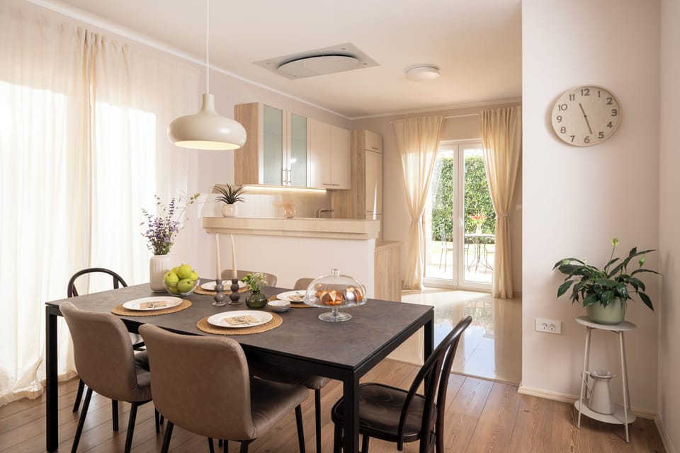 Bright dining area with a comfortable table for shared meals and gatherings.