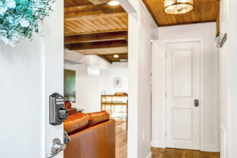 Entry into the house via keypad. Enter into the hallway and then the living room and bunk room.