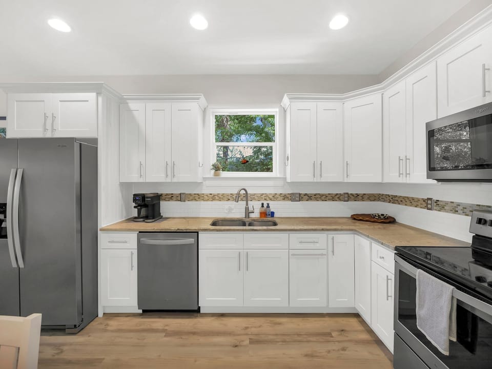 Full Kitchen. Fridge. Dual Coffee Maker. Dish Washer. Oven/Stove. Microwave.