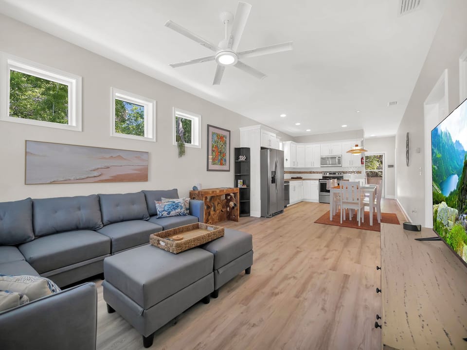 Living room w/ couch and Smart TV