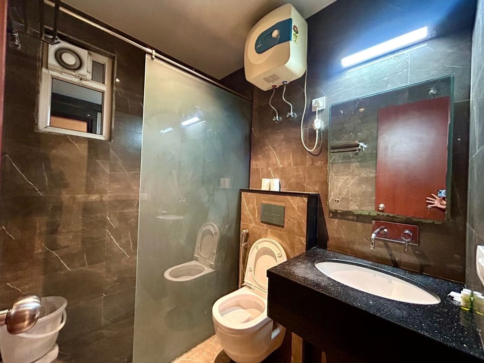 Deluxe Double Room, City View | Bathroom | Shower, designer toiletries, hair dryer, slippers