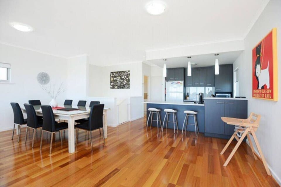Gather around the dining table for long breakfasts and relaxed dinners, perfectly positioned within the open-plan space to keep everyone connected.