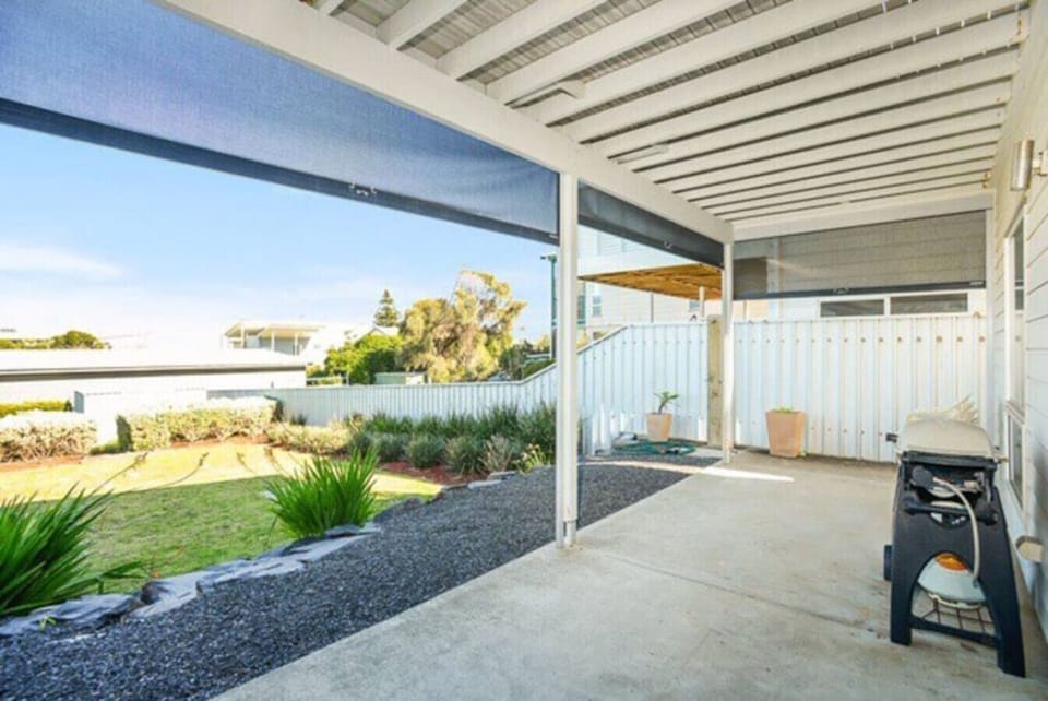 The secure backyard offers space to relax and play, with a BBQ ready for easy outdoor meals and a private setting for slow afternoons.