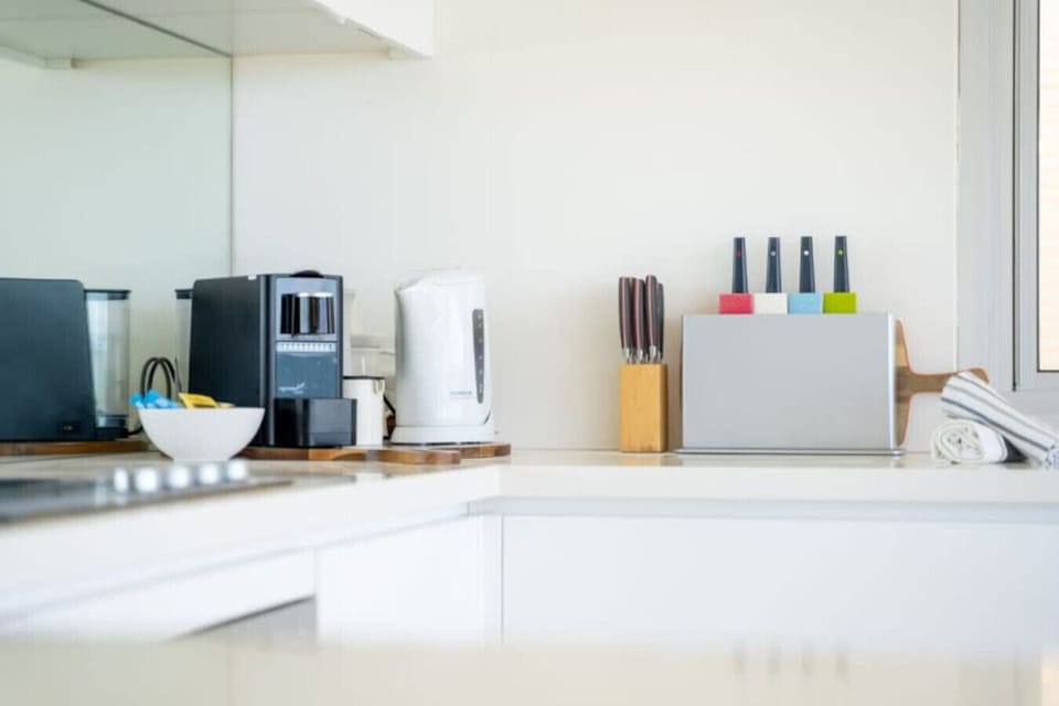 Everything you need at hand—appliances, knives, and clever bench space for easy meal prep.
