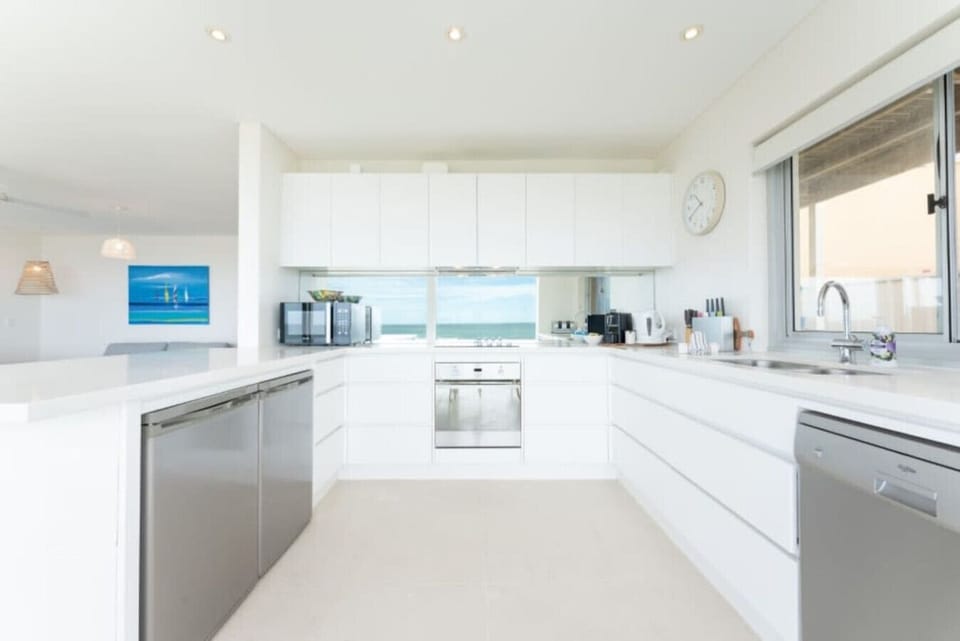 Cook with ease in the open kitchen, where every meal comes with a glimpse of the sea.