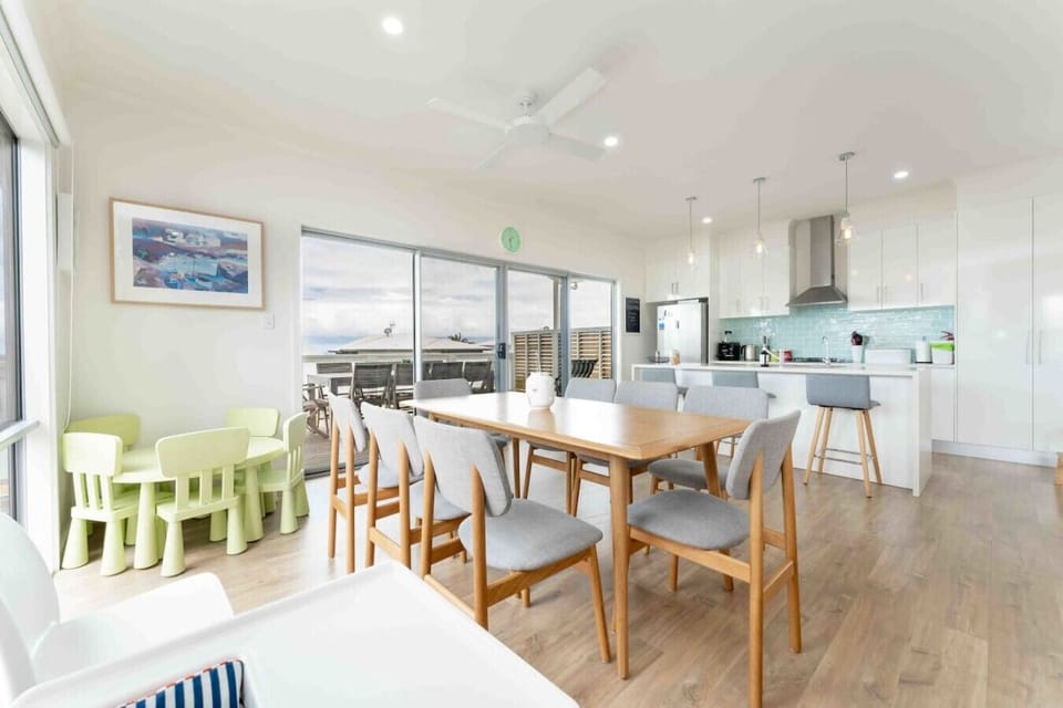 Share meals around the dining table overlooking the balcony, with plenty of space for everyone to gather and a dedicated children’s dining corner that makes family mealtimes simple.