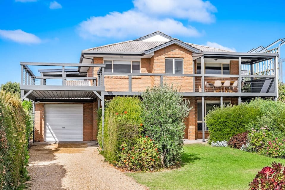 Arrive at a welcoming coastal retreat framed by lush gardens, with spacious balconies designed for soaking up the sun and sea air.