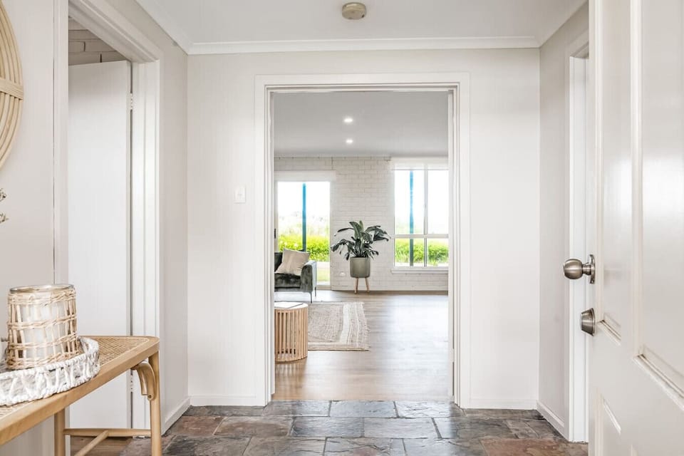 Step through the entryway and be welcomed by bright interiors that open up to inviting living spaces.