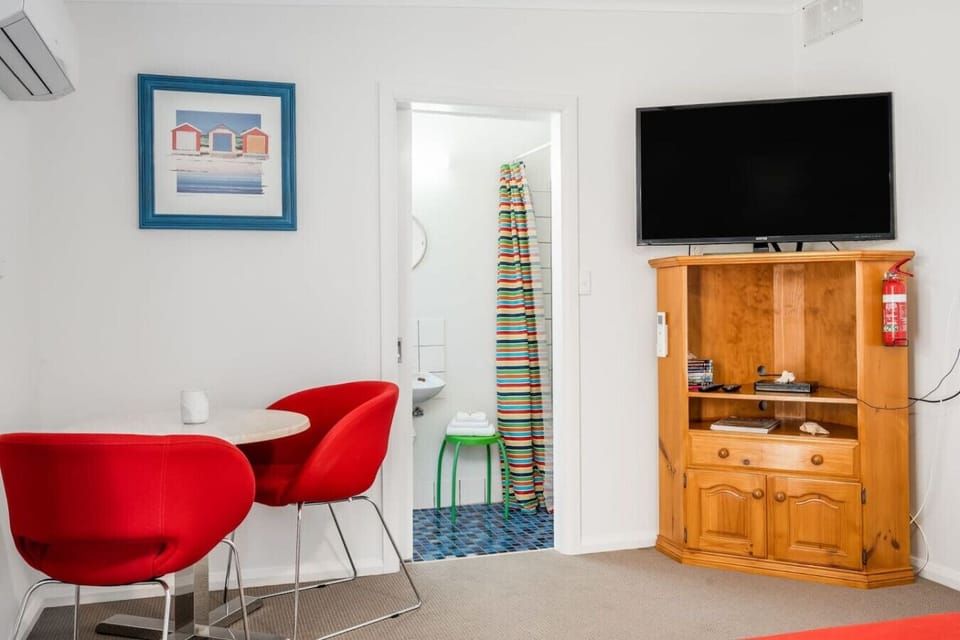 A private setup with its own ensuite and sitting area—perfect for guests wanting space.