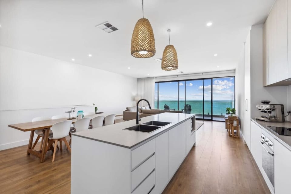 Cook with ease in the open-plan kitchen, where clean lines and generous bench space make group meals feel effortless.