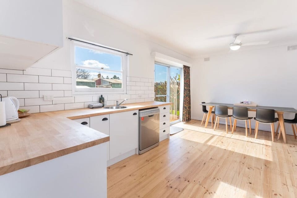 Prepare meals with ease in the fully equipped kitchen, then gather around the sunlit dining table or step outside for an alfresco barbecue.