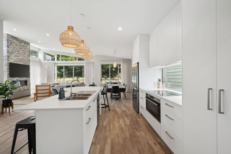 Streamlined cabinetry and modern appliances give this kitchen a refined edge.