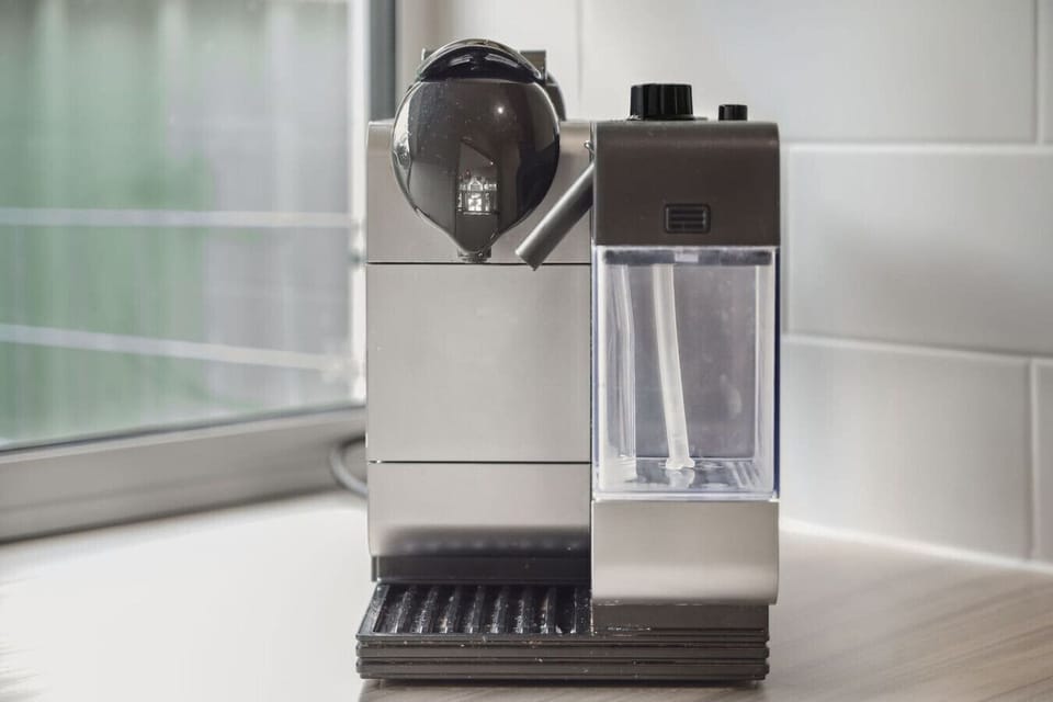 Coffee lovers will appreciate the sleek espresso machine, ready for your morning brew.