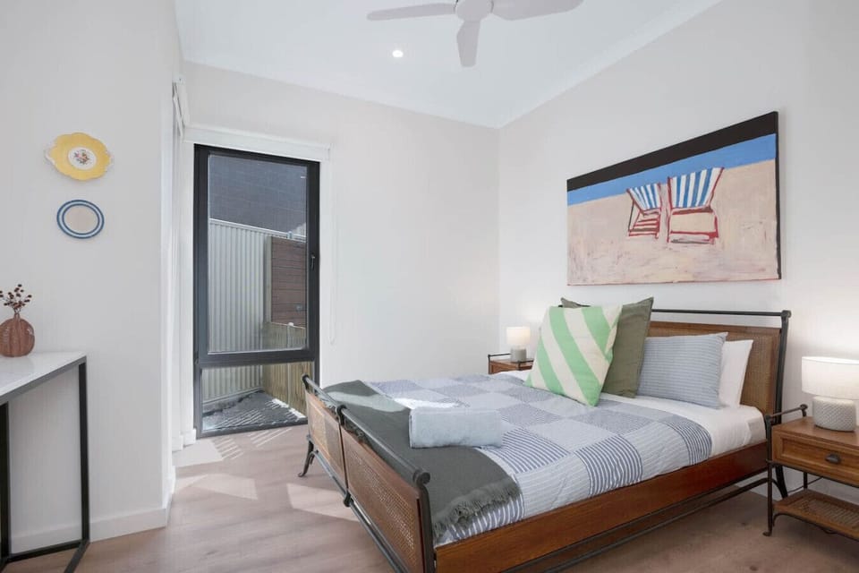 Recharge in the fifth bedroom, featuring a queen bed and a quiet, comfortable layout well suited to longer stays.