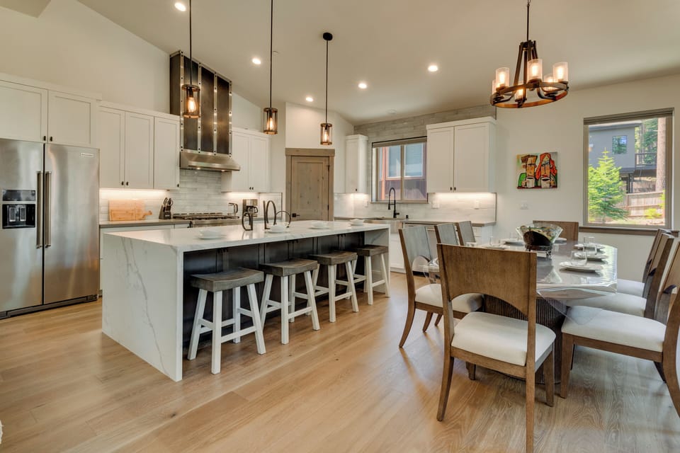 Kitchen with stainless appliances and breakfast bar