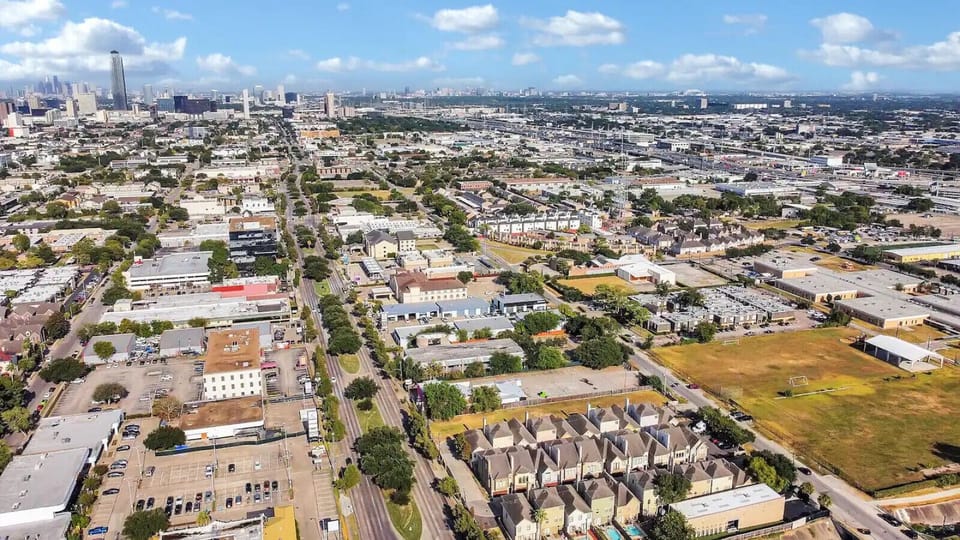 A stunning aerial view of our community set against the vibrant skyline of Houston.