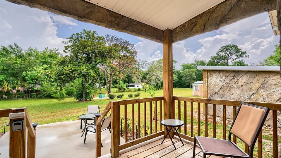 View out from the front porch! With an identical table chair on left.