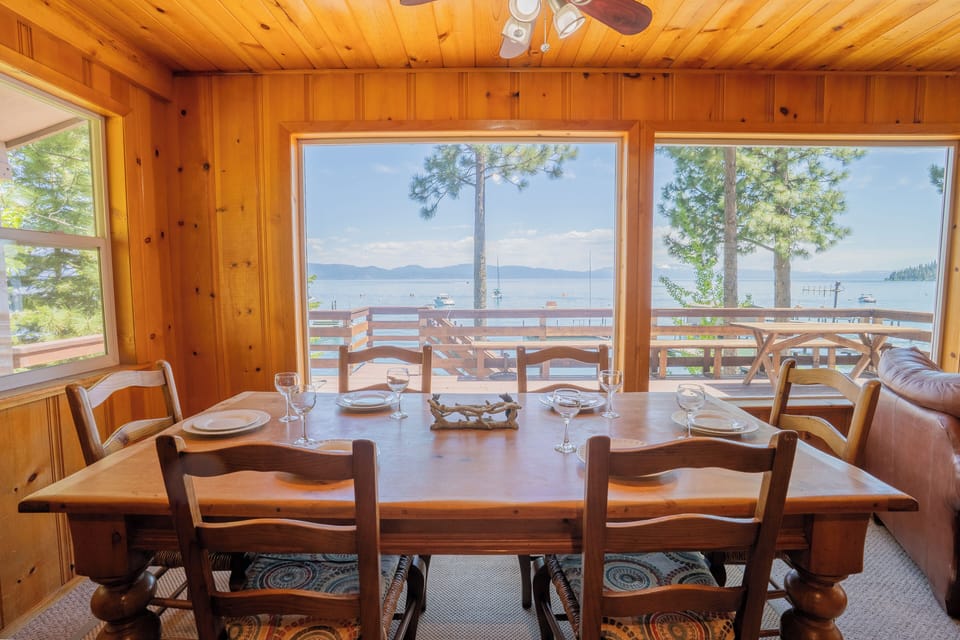 The dining table seats six and sits perfectly positioned to enjoy views of the lake