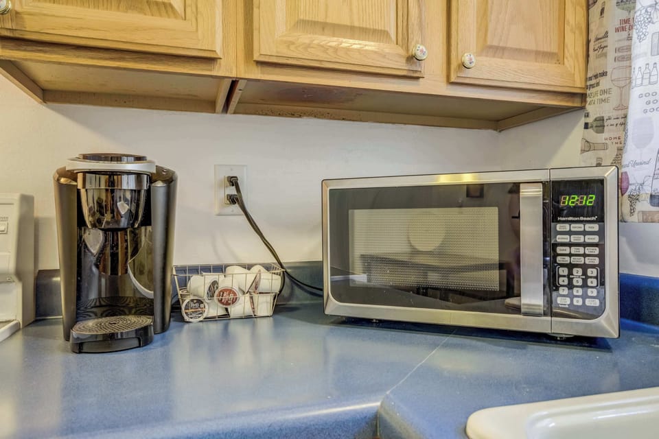 Fully stocked kitchen with modern appliances, a spice rack, and a convenient coffee station—perfect for easy meals and relaxed mornings.







