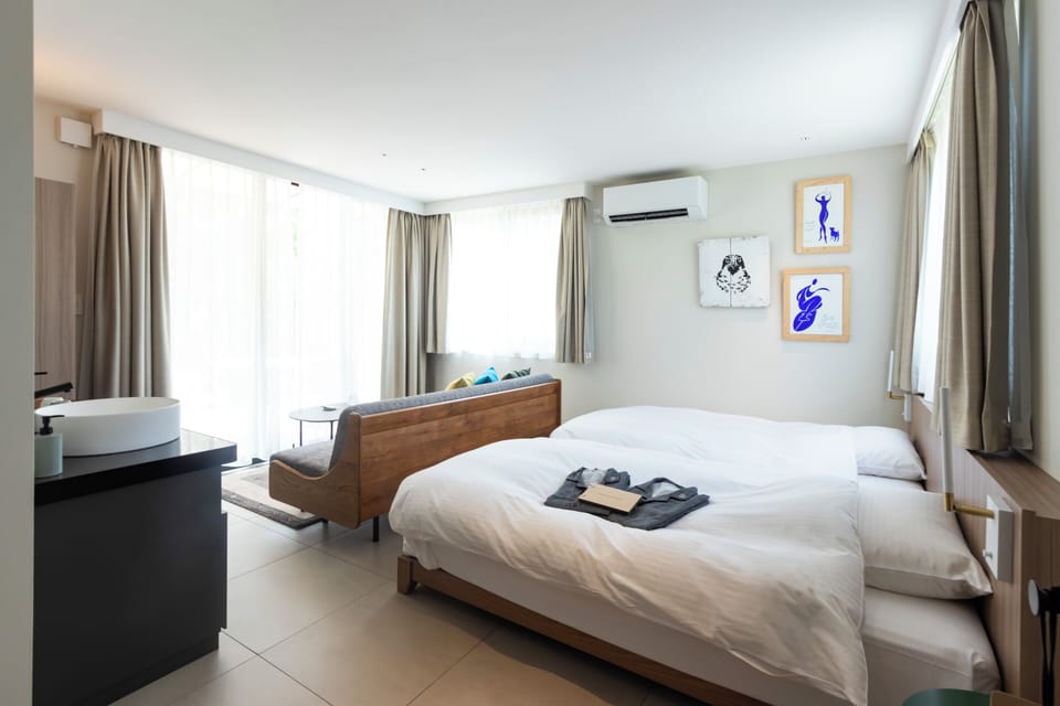 Basic Twin Room, Mountain View | Minibar (free items), in-room safe, blackout drapes, WiFi (free)