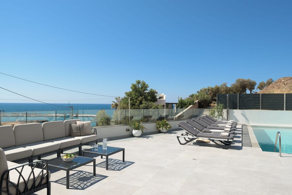 Outdoor terraces frame sea views with comfort, style, and quiet elegance.