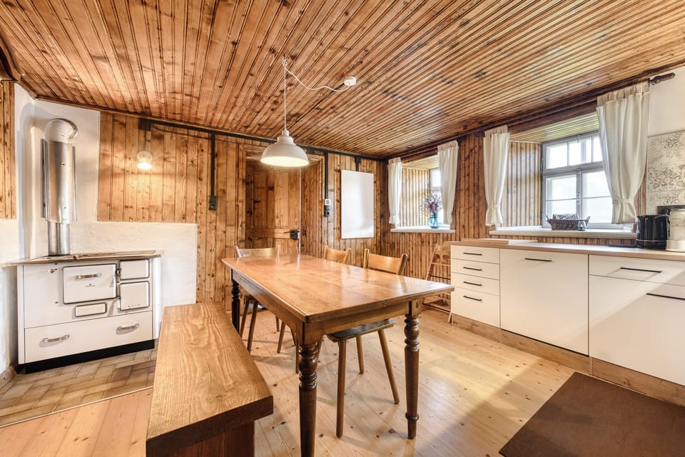 Deluxe Chalet, Mountain View | Private kitchen | Toaster, highchair, dining table