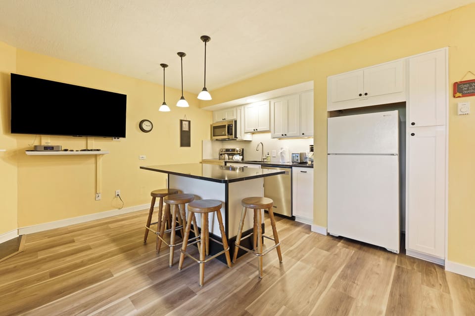 The Kitchen boasts an island with seating for 4.