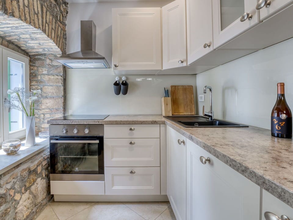 Countertop, Cabinetry, Kitchen, Flooring, Interior Design, Furniture, Tap, Kitchen Appliance, Plumbing Fixture, Drawer