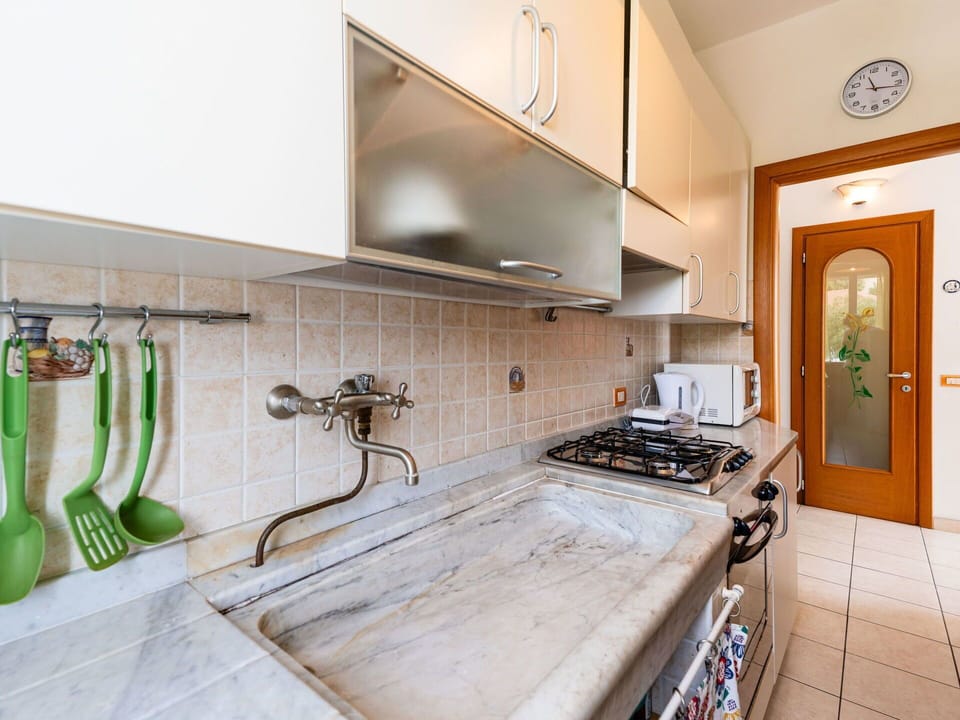 Kitchen, Countertop, Kitchen Appliance, Flooring, Kitchen Sink, Major Appliance, Interior Design, Plumbing Fixture, Floor, Tap