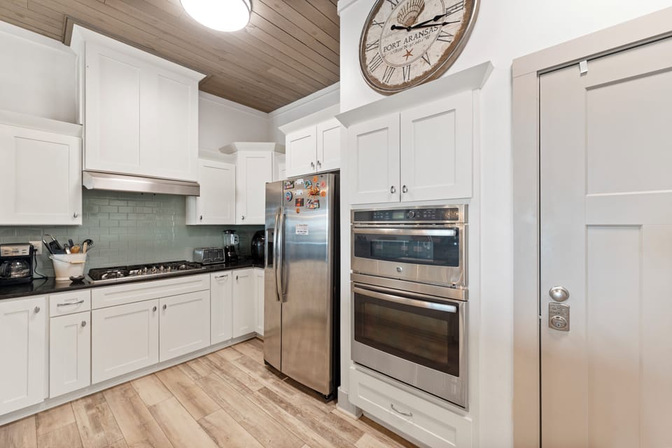 Your fully equipped kitchen awaits with modern appliances and charming rustic touches for memorable home-cooked meals.