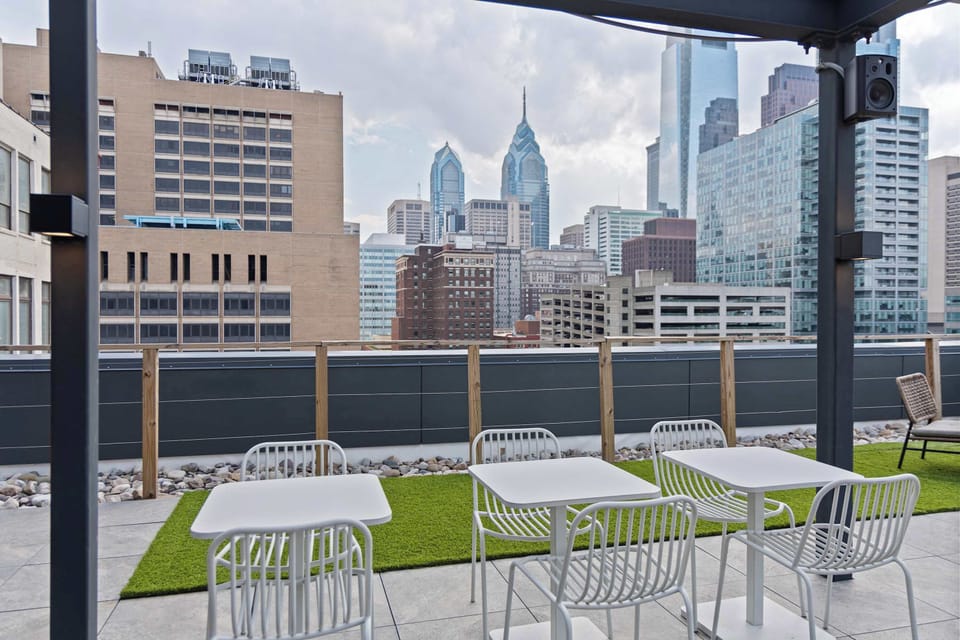 Rooftop terrace with city views and outdoor seating